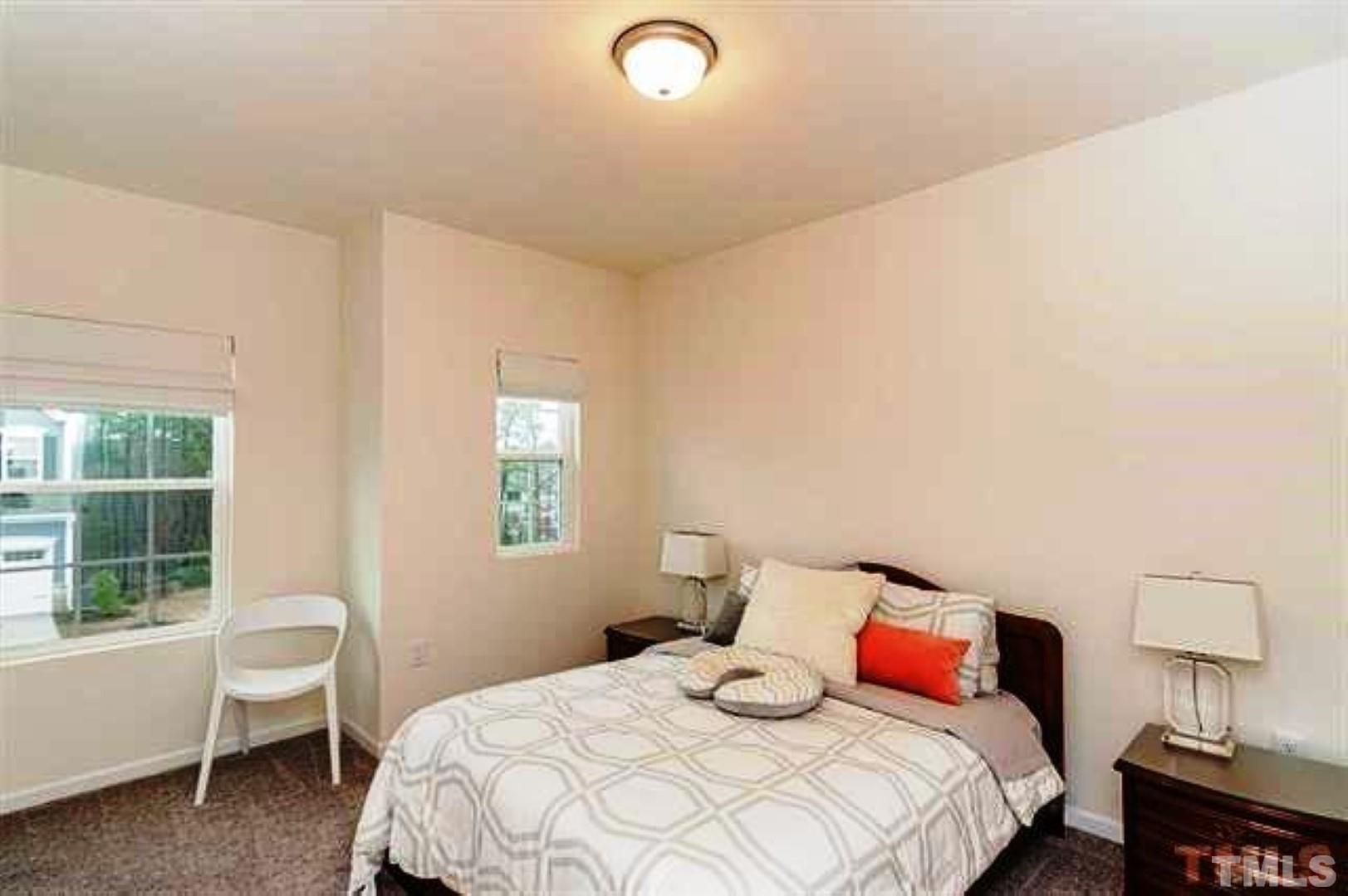 1118 Epiphany Road Morrisville, NC 27560 - Photo 17 of 20 a bedroom with a bed and a window