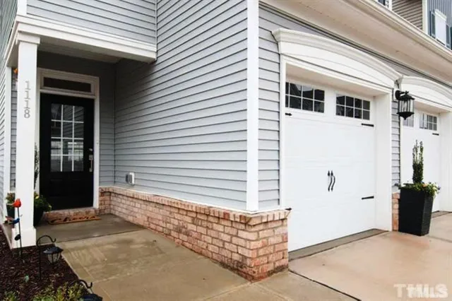 a view of entryway with a potted plant and garage