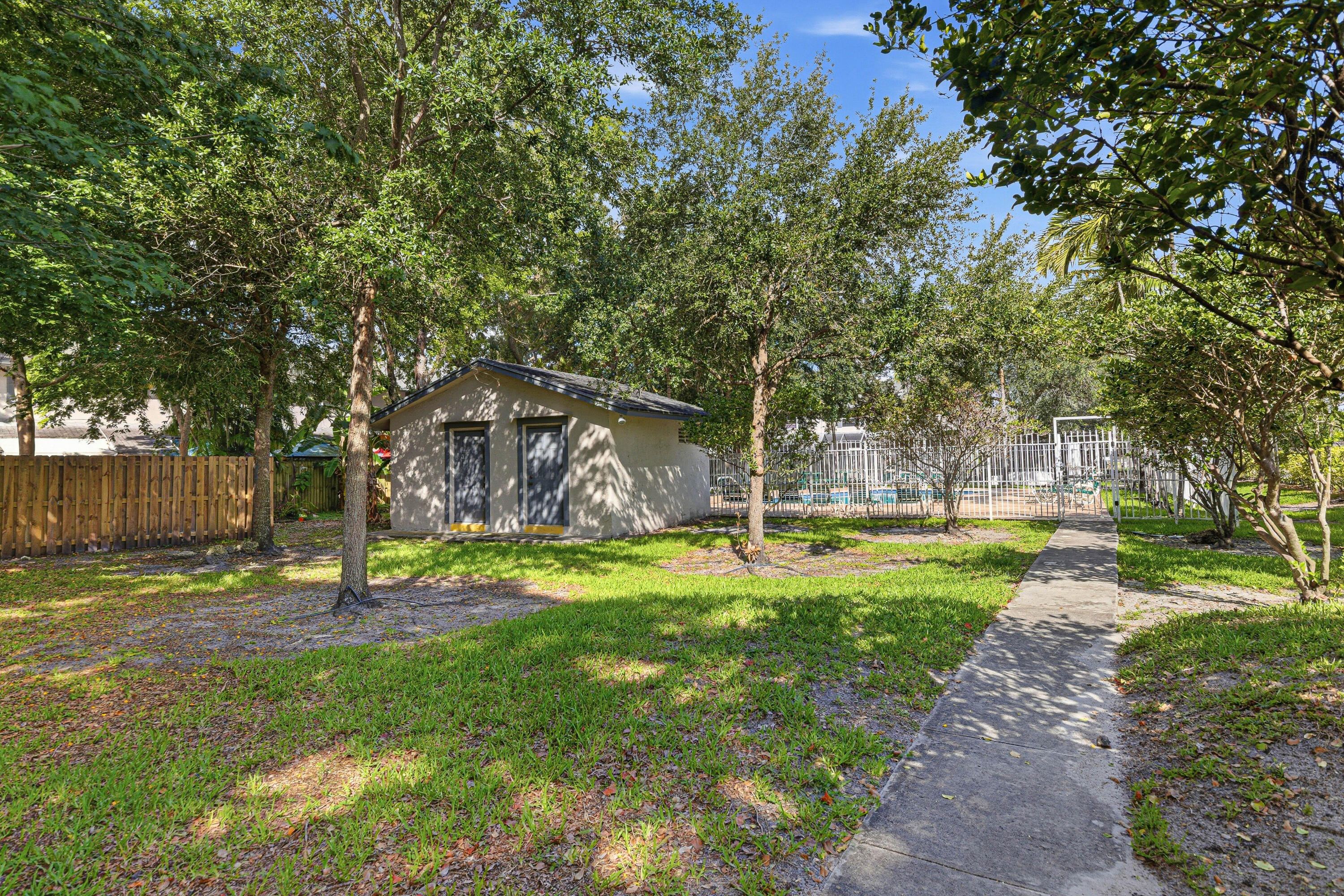 8207 Fairway Road, Unit 8207 Sunrise, FL 33351 - Photo 30 of 34 Pool Entrance