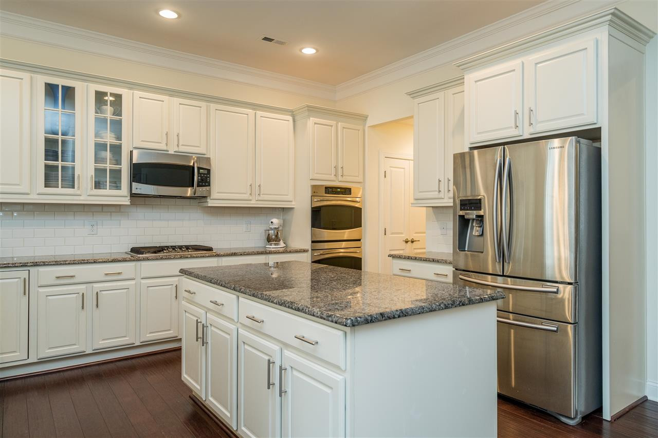 5616 Wade Park Boulevard Raleigh, NC 27607 - Photo 10 of 30 You don't want to miss these beautiful white cabinets with white subway tile backsplash and granite counters! Kitchen