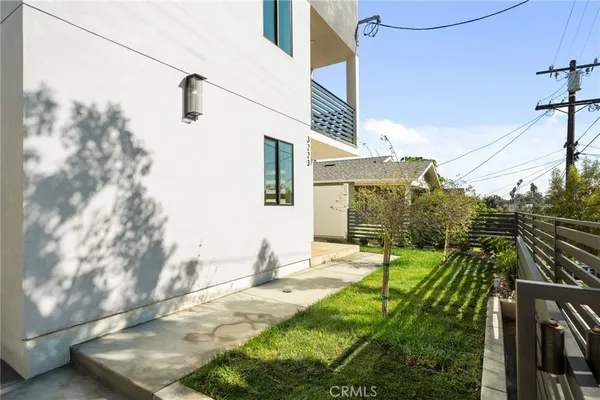 a view of a backyard of the house