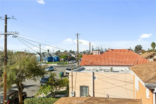 a view of a street with a building in the background