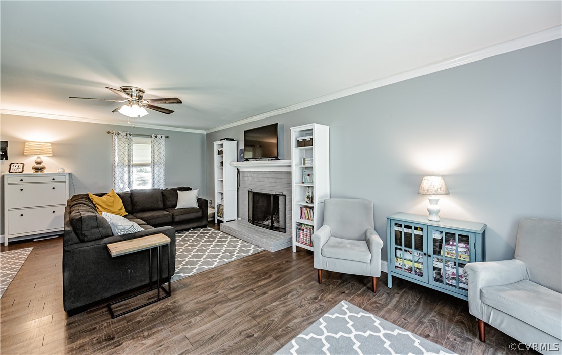 5018 Rollingway Road Chesterfield, VA 23832 - Photo 14 of 49 a living room with furniture and a fireplace