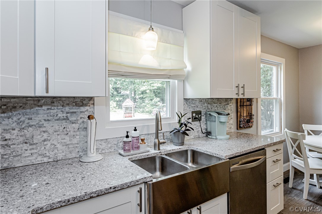 5018 Rollingway Road Chesterfield, VA 23832 - Photo 23 of 49 a kitchen with granite countertop a sink and a stove