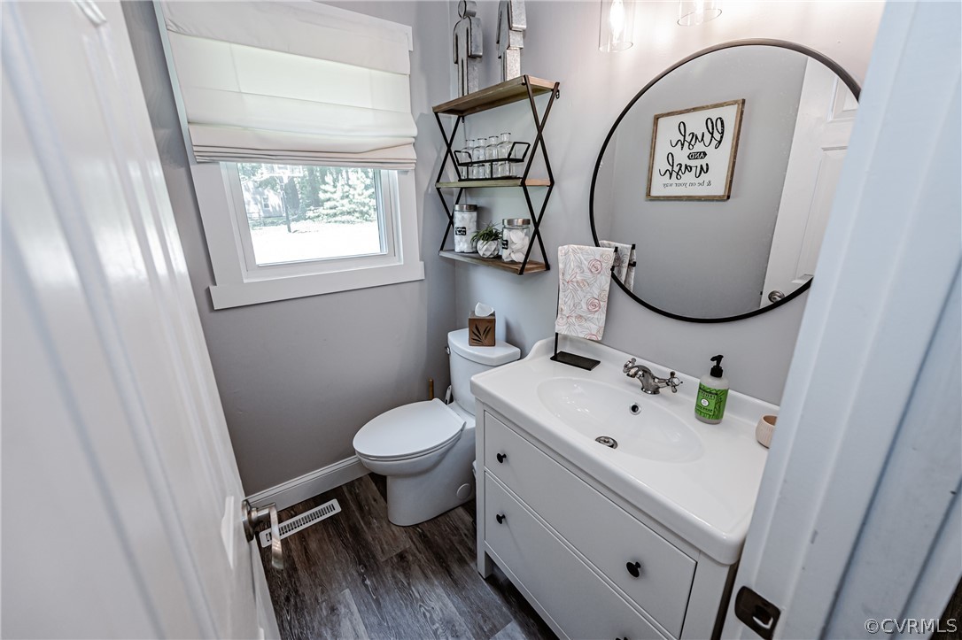 5018 Rollingway Road Chesterfield, VA 23832 - Photo 26 of 49 a bathroom with a toilet sink and mirror