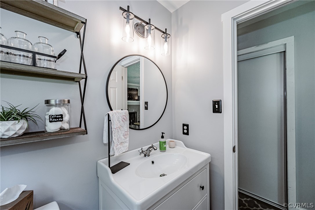 5018 Rollingway Road Chesterfield, VA 23832 - Photo 27 of 49 a bathroom with a sink and a mirror