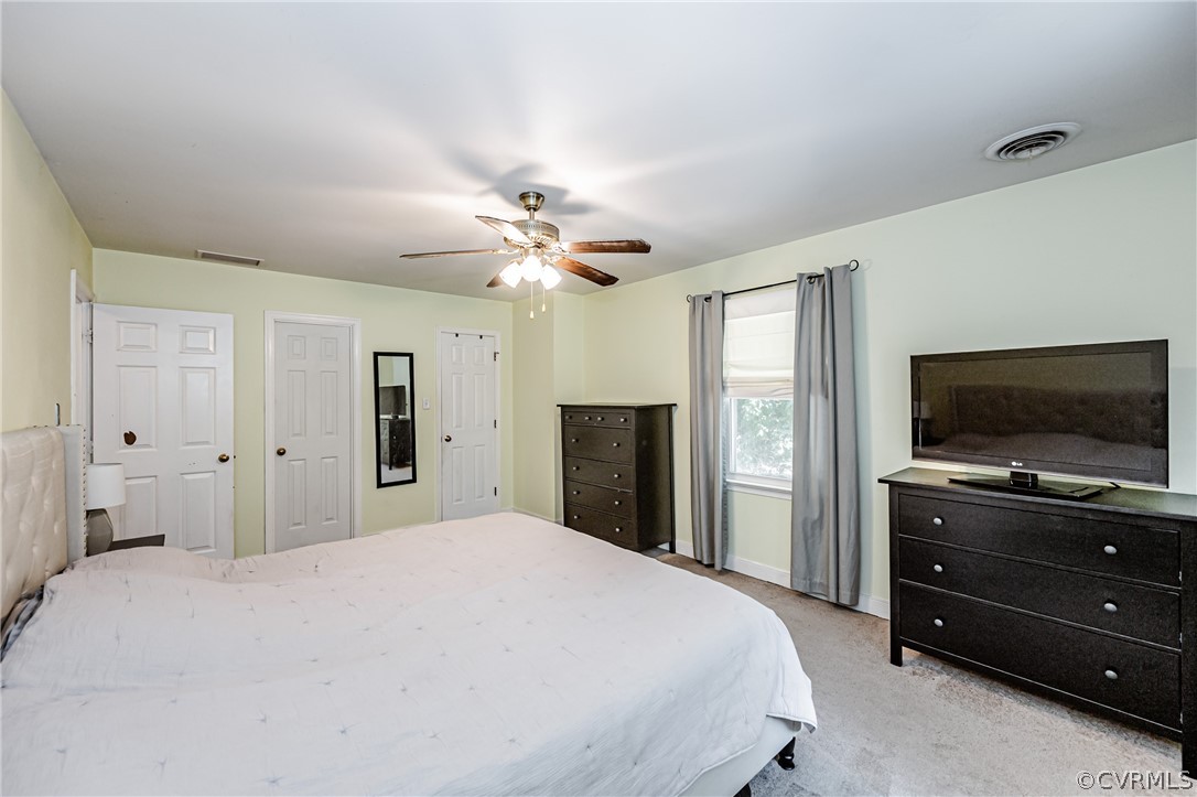 5018 Rollingway Road Chesterfield, VA 23832 - Photo 32 of 49 a bedroom with a bed and a flat screen tv
