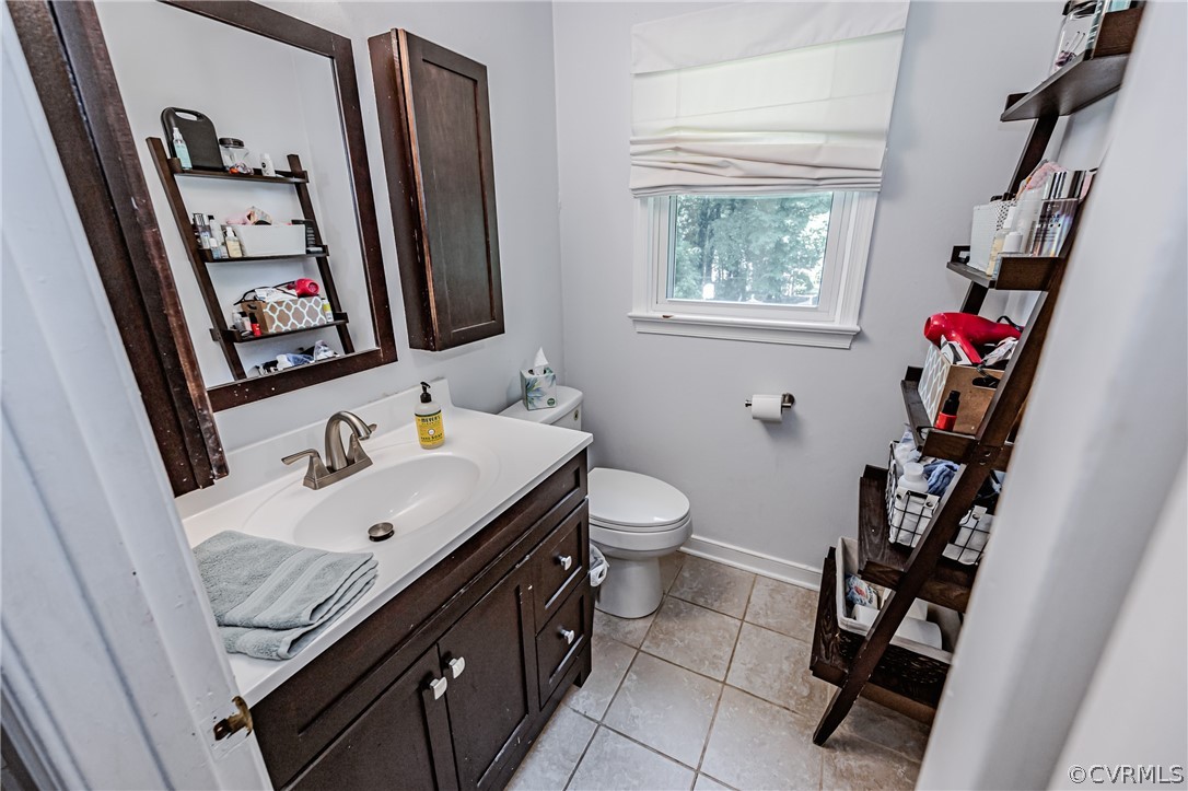5018 Rollingway Road Chesterfield, VA 23832 - Photo 34 of 49 a bathroom with a sink toilet and a mirror
