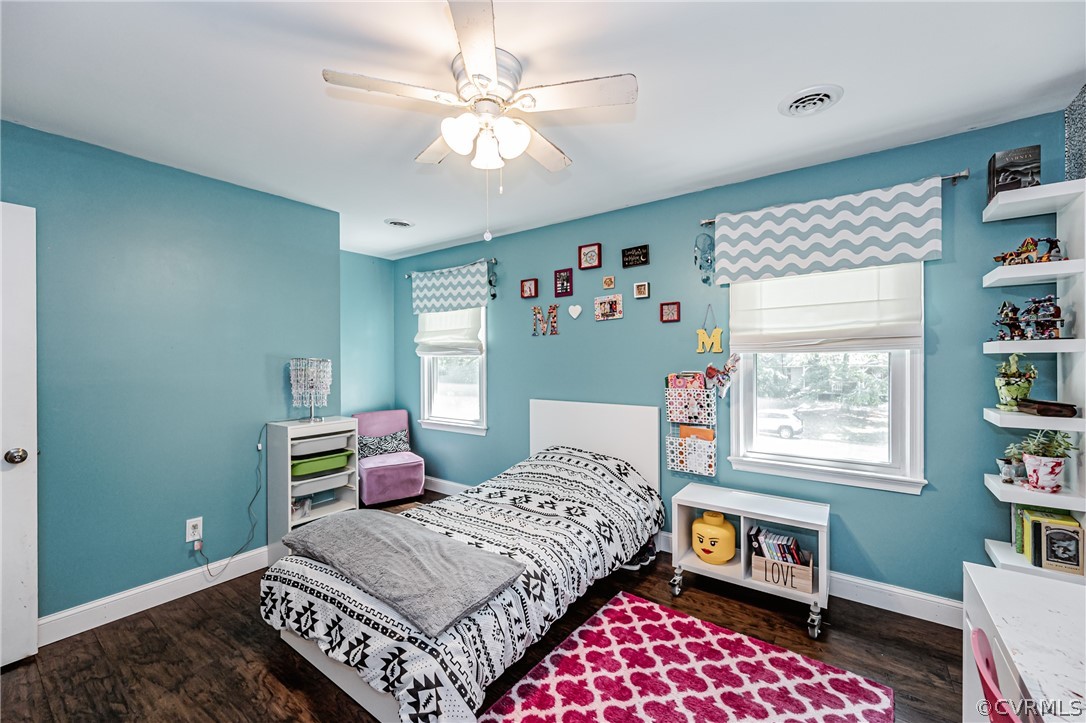 5018 Rollingway Road Chesterfield, VA 23832 - Photo 38 of 49 a bedroom with a bed bookshelf and a window