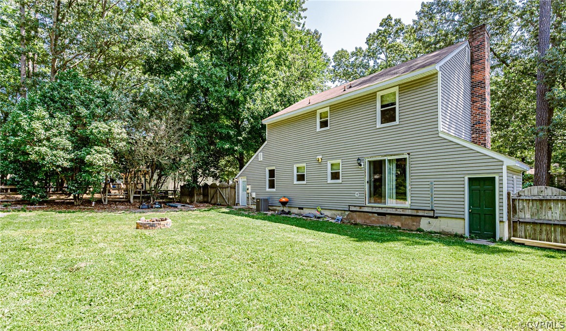 5018 Rollingway Road Chesterfield, VA 23832 - Photo 44 of 49 a front view of house with yard and trees in the background