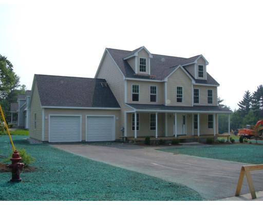 Lot 4 John Riley Road Ayer, MA 01432 - Photo 1 of 4 a front view of a house with a garden