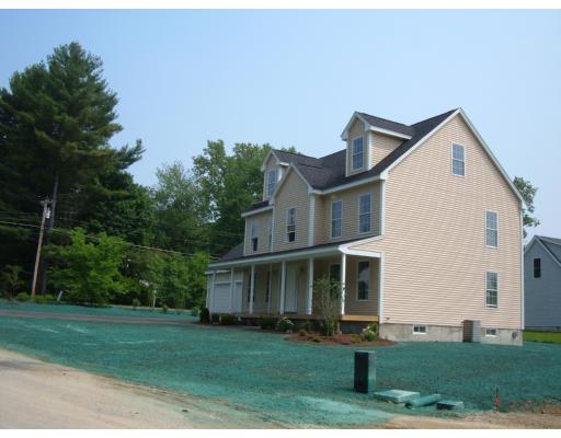 Lot 4 John Riley Road Ayer, MA 01432 - Photo 3 of 4 a view of a white house next to a yard with big trees