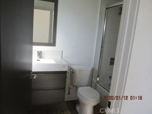 a bathroom with a toilet and a sink