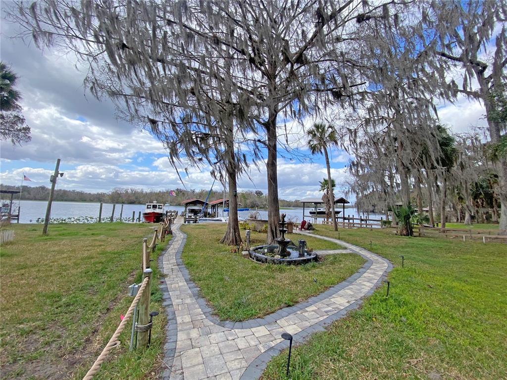 101 Orange Street Satsuma, FL 32189 - Photo 28 of 65 a view of a park with swings and slides