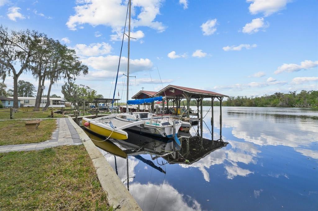 101 Orange Street Satsuma, FL 32189 - Photo 32 of 65 a view of a lake with couches in the patio