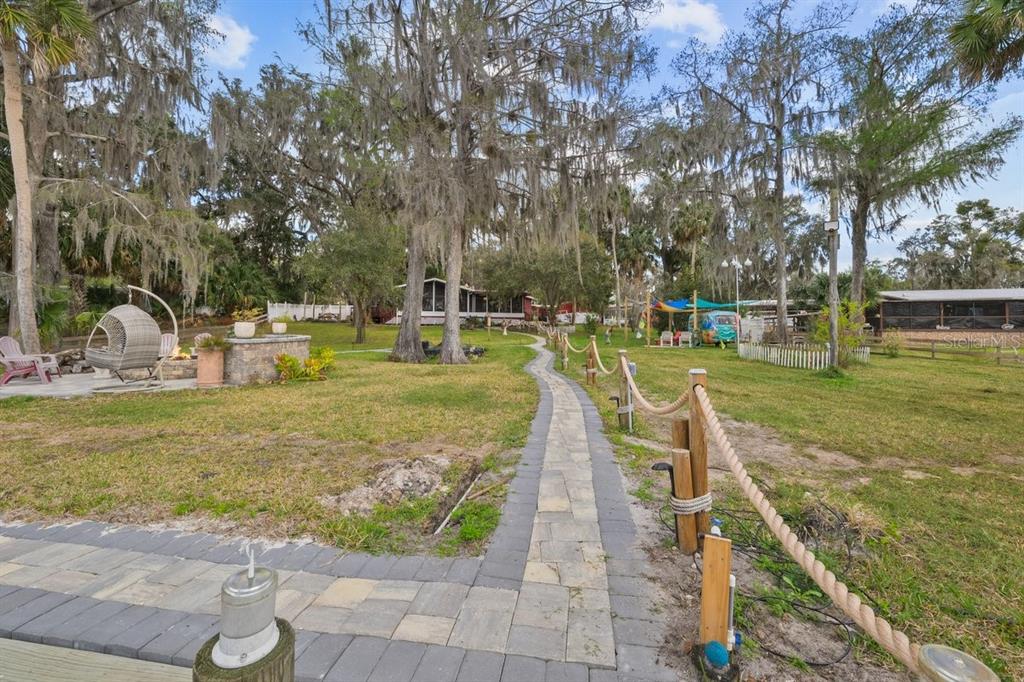 101 Orange Street Satsuma, FL 32189 - Photo 37 of 65 a view of a swimming pool with a patio