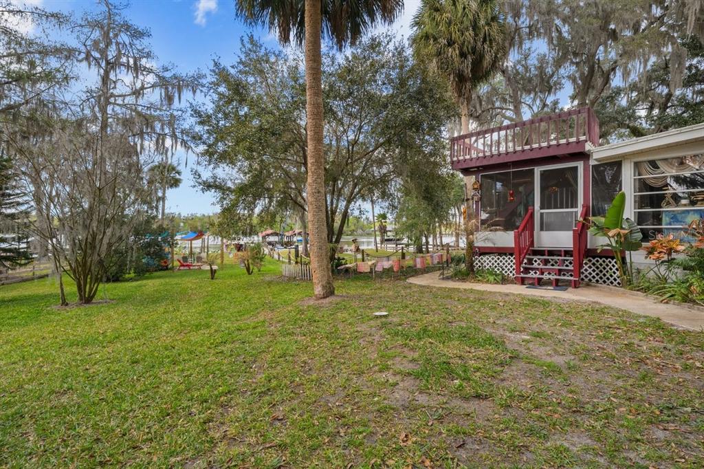 101 Orange Street Satsuma, FL 32189 - Photo 38 of 65 a view of a house with a yard