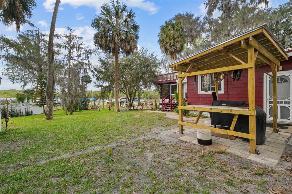 101 Orange Street Satsuma, FL 32189 - Photo 40 of 65 a view of a house with a yard porch and sitting area