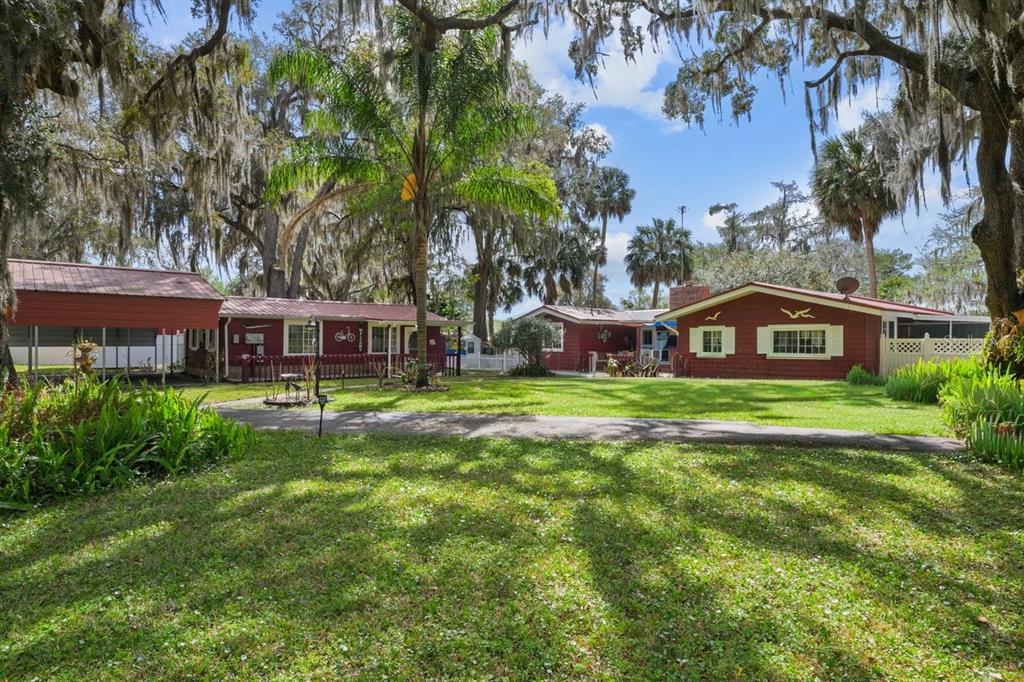 101 Orange Street Satsuma, FL 32189 - Photo 41 of 65 a front view of a house with a garden
