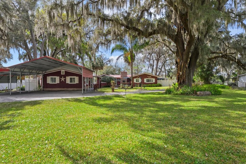 101 Orange Street Satsuma, FL 32189 - Photo 42 of 65 a front view of a house with garden