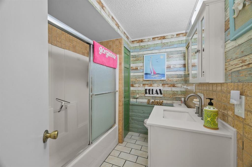 101 Orange Street Satsuma, FL 32189 - Photo 48 of 65 a bathroom with a sink and a shower