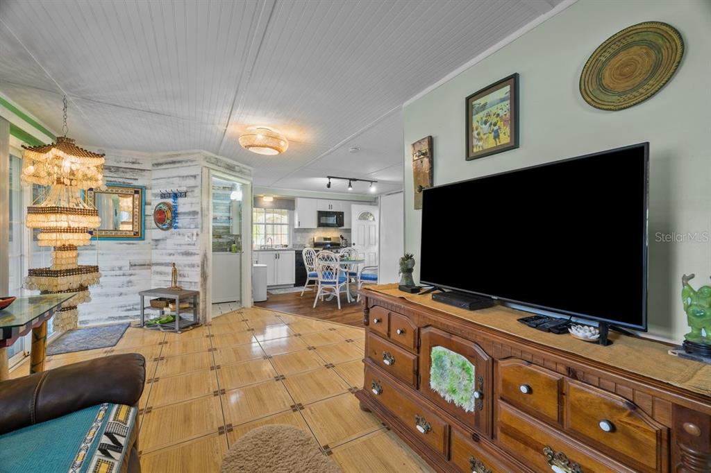 101 Orange Street Satsuma, FL 32189 - Photo 51 of 65 a living room with furniture and a flat screen tv