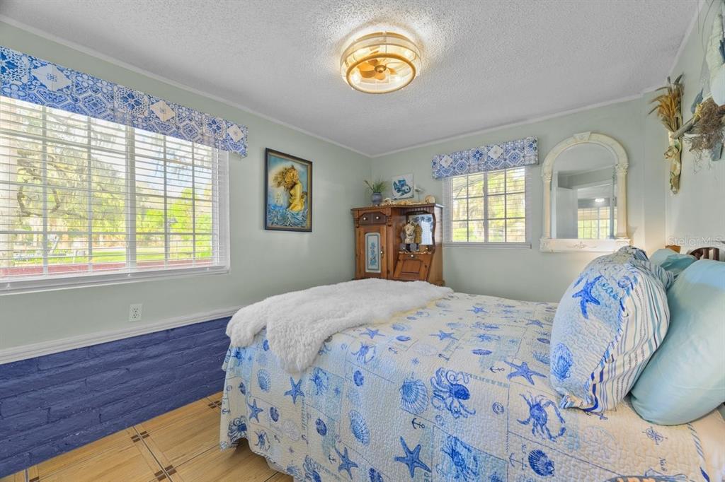 101 Orange Street Satsuma, FL 32189 - Photo 52 of 65 a bedroom with a bed and window
