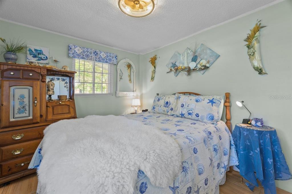 101 Orange Street Satsuma, FL 32189 - Photo 53 of 65 a bedroom with a bed and a window