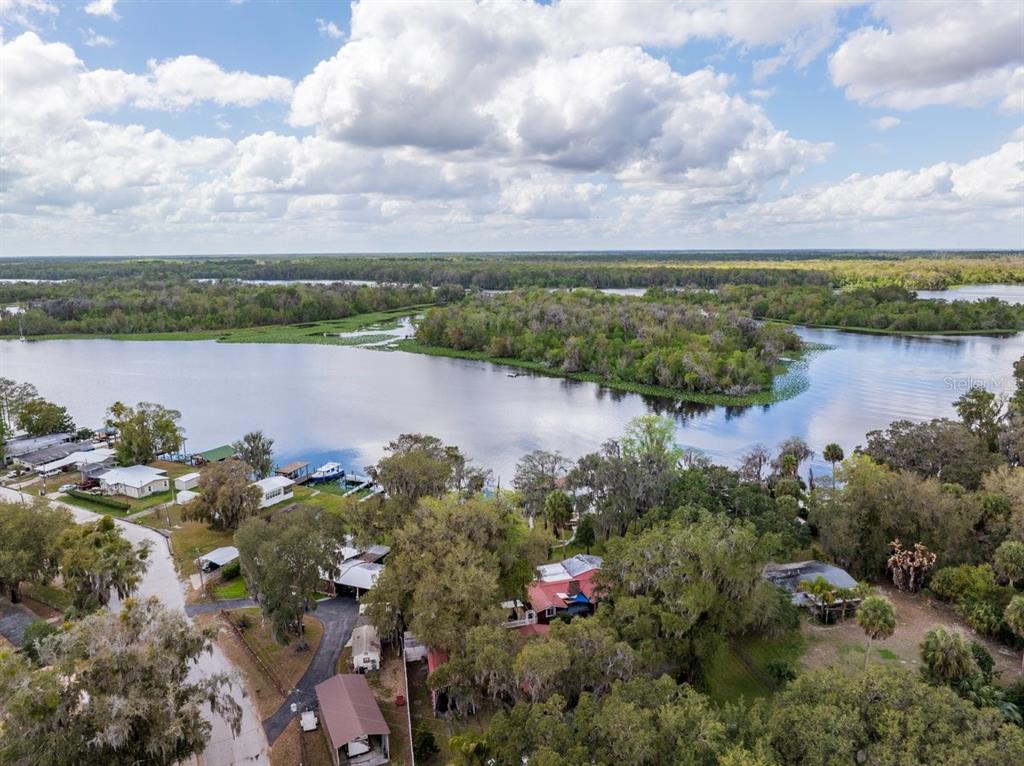 101 Orange Street Satsuma, FL 32189 - Photo 56 of 65 a view of a lake with houses in the back