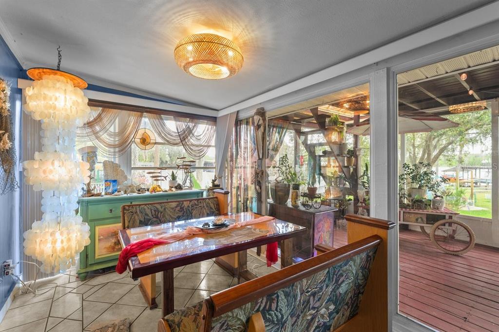 101 Orange Street Satsuma, FL 32189 - Photo 9 of 65 a view of a dining room with furniture window and outside view