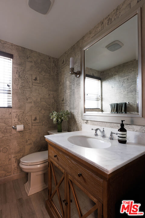 36 Navy Street, Unit 4 Venice, CA 90291 - Photo 16 of 37 a bathroom with a sink a toilet and a mirror