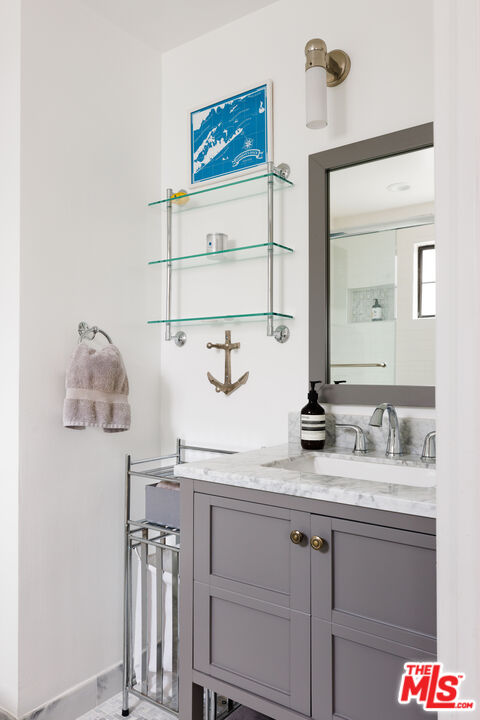 36 Navy Street, Unit 4 Venice, CA 90291 - Photo 21 of 37 a bathroom with a sink and a mirror