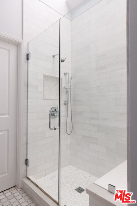 36 Navy Street, Unit 4 Venice, CA 90291 - Photo 26 of 37 a bathroom with a glass shower door