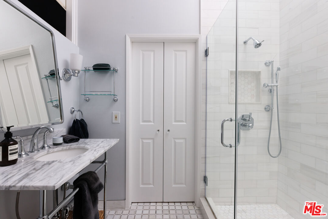 36 Navy Street, Unit 4 Venice, CA 90291 - Photo 27 of 37 a bathroom with a sink and a mirror