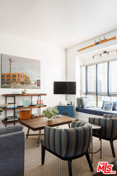 36 Navy Street, Unit 4 Venice, CA 90291 - Photo 5 of 37 a living room with furniture and a flat screen tv
