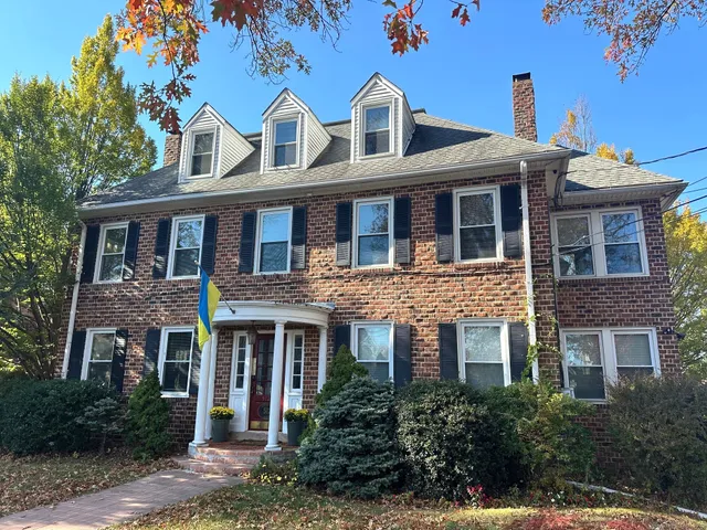 a front view of residential houses with yard