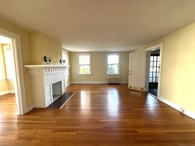 a view of livingroom with furniture wooden floor and windows