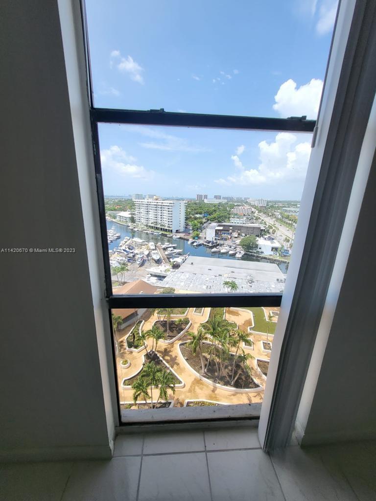 13499 Biscayne Boulevard, Unit 1204 North Miami, FL 33181 - Photo 3 of 14 a view of a large window with an outdoor view