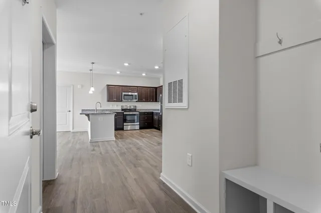 a view of kitchen with wooden floor