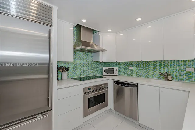 a kitchen with a stove and a refrigerator