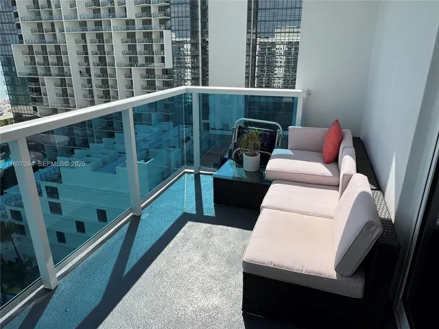 a view of balcony with furniture