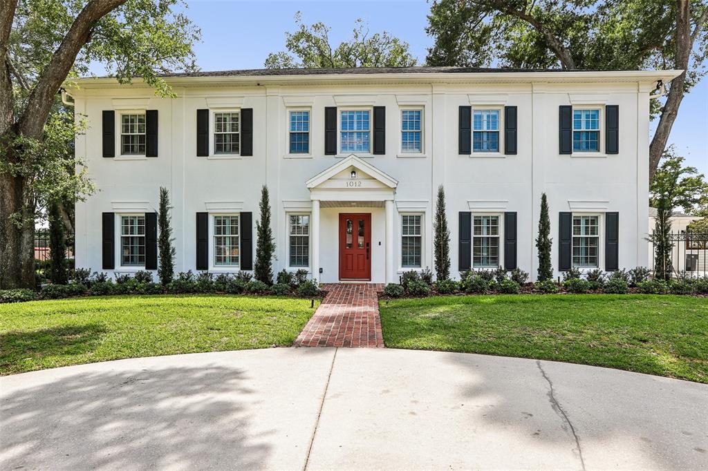 1012 Morfield Lane Brandon, FL 33511 - Photo 1 of 100 a front view of a house with a yard