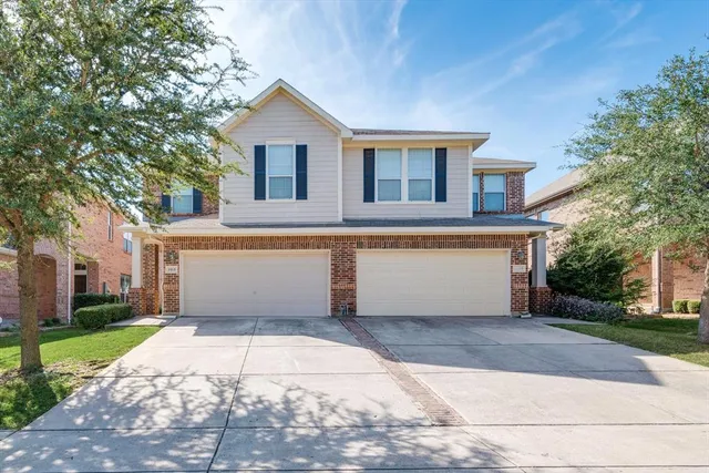 a view of a white house with a outdoor space