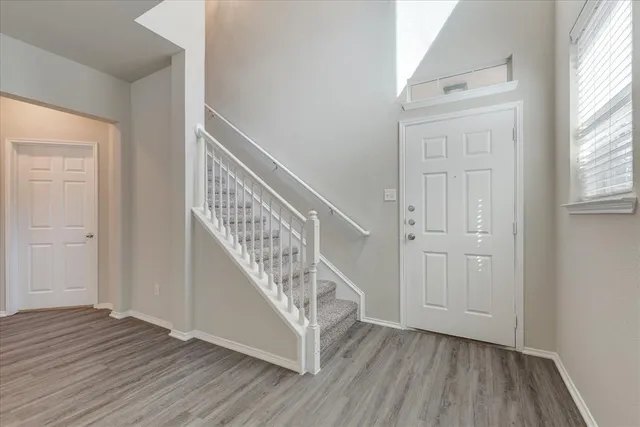 a view of entryway with wooden floor