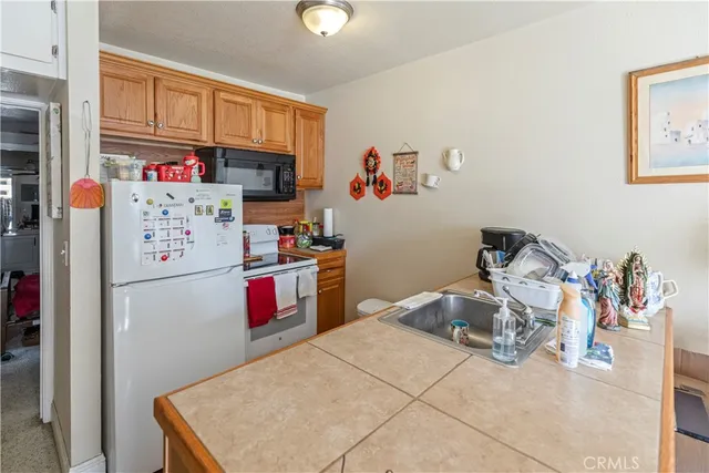 a bedroom with furniture a flat screen tv and a bed