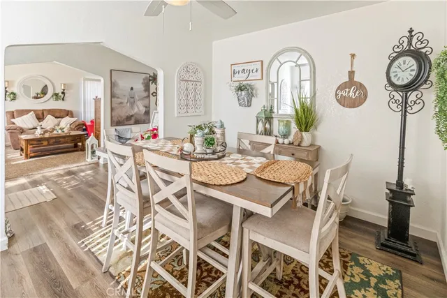 a view of a dining room with furniture and a large window