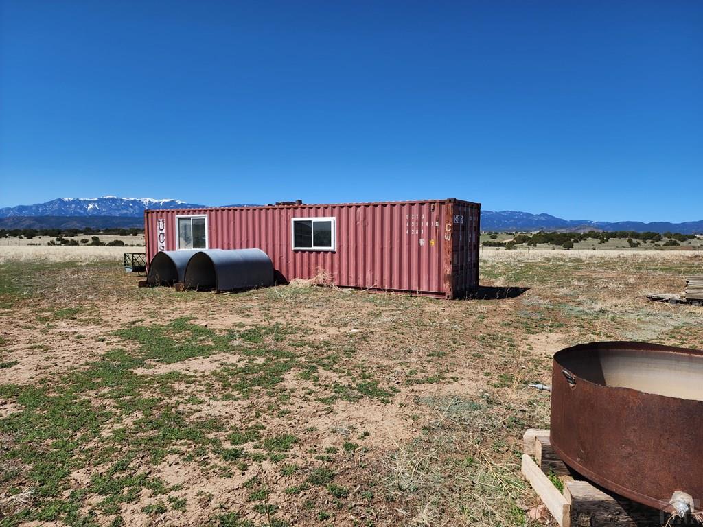 6023 South Waterbarrel Road Beulah, CO 81023 - Photo 18 of 63 a view of a ocean with a building in the background
