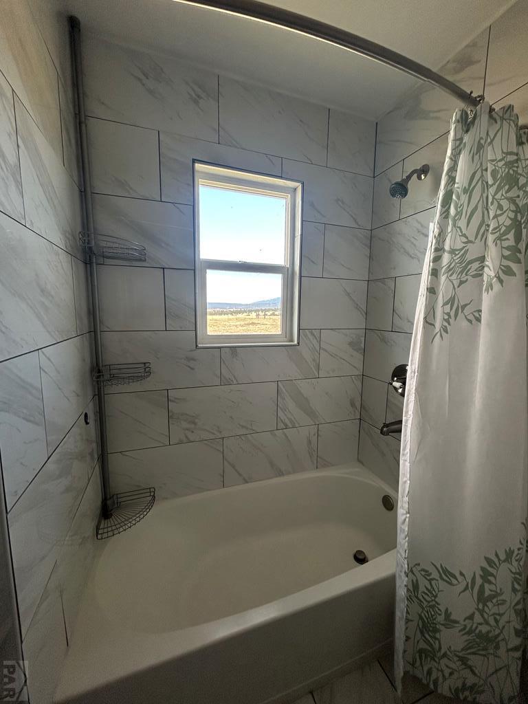 6023 South Waterbarrel Road Beulah, CO 81023 - Photo 28 of 63 a bathroom with a shower and a bathtub