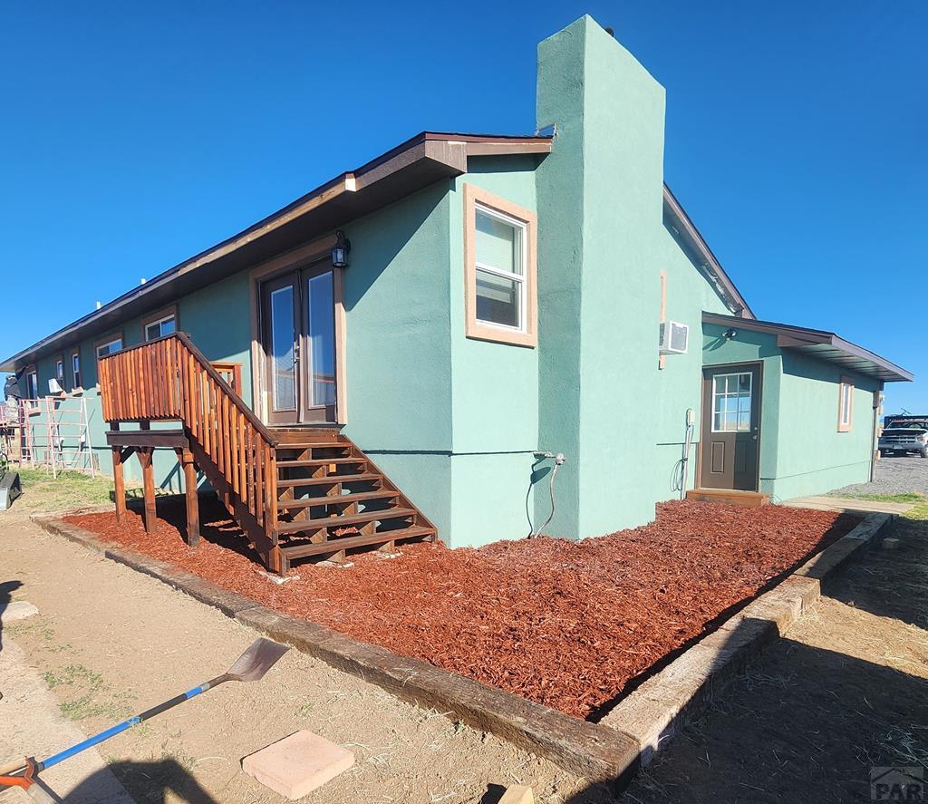 6023 South Waterbarrel Road Beulah, CO 81023 - Photo 5 of 63 a front view of a house with balcony