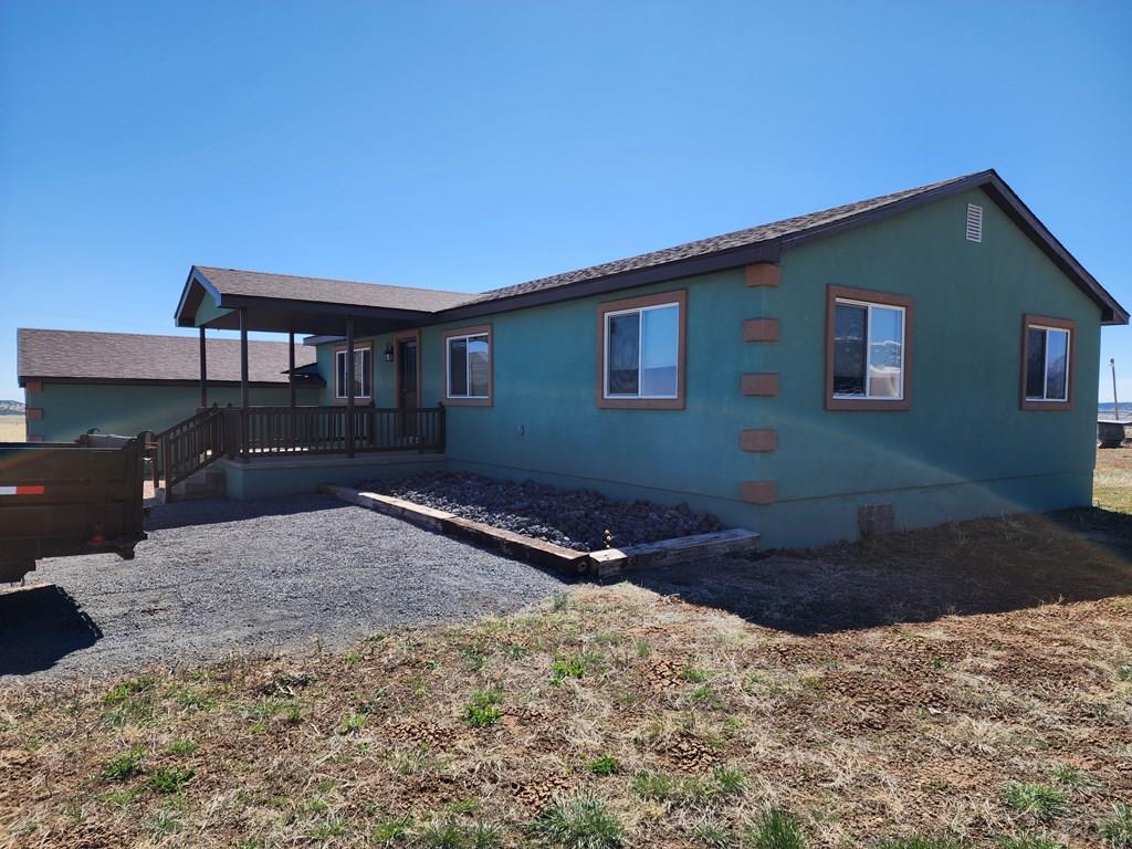 6023 South Waterbarrel Road Beulah, CO 81023 - Photo 8 of 63 a house view with a backyard space